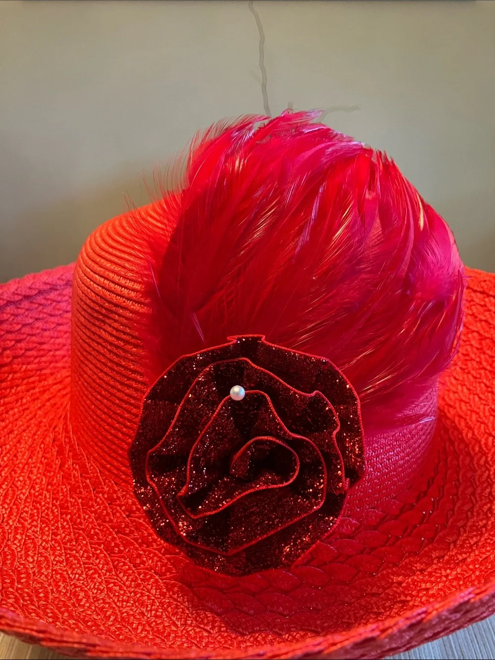 Elegant Women's Red Wide-Brim Straw Hat with Red Floral and Feather Accent